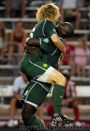 Portland's Stephen Keel jumps into the arms of his teammate Mamadou Danso after scoring the go ahead goal in the 85th minute during their soccer match against the Austin Aztex on Monday.  